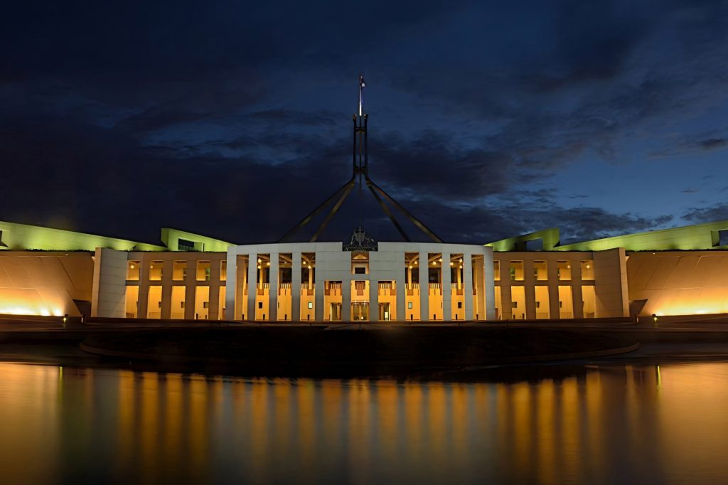 Building on a river at nighttime