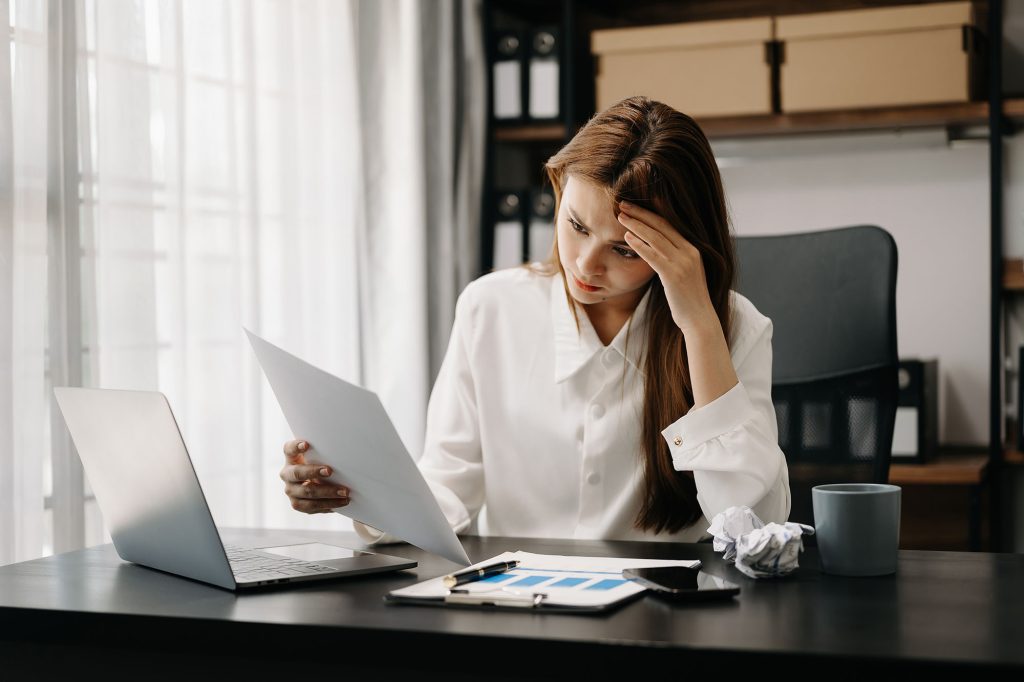 business woman is stressed bored overthinking from working tablet office
