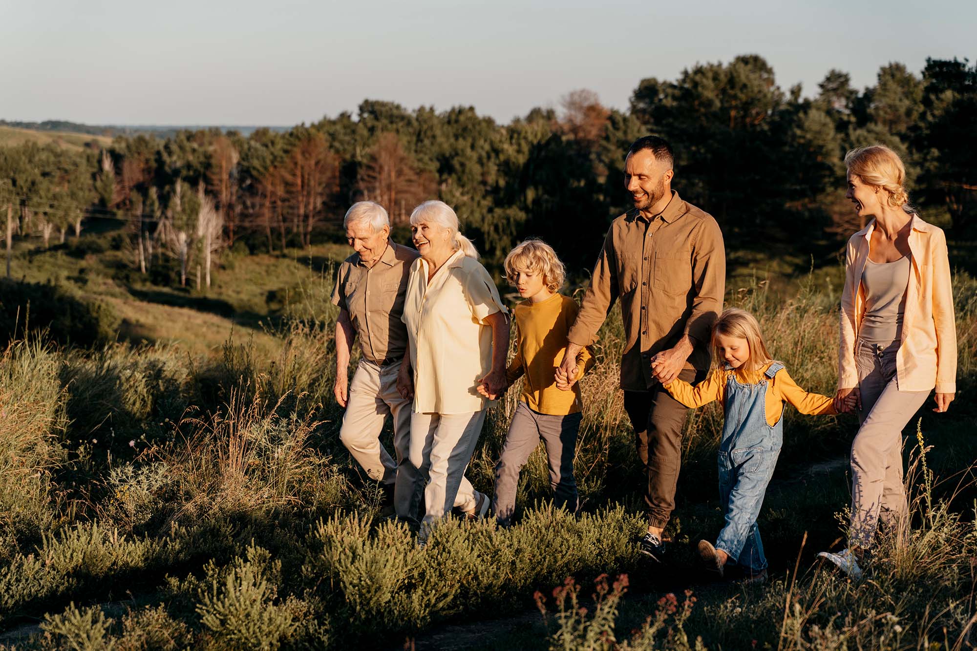 Happy Family walking through field